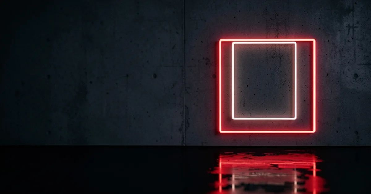 A small white neon rectangle outline nested inside a larger red one on a dark wall
